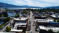 Aerial view of downtown Sandpoint, Idaho, looking down First Avenue past the marina toward Lake Pend Oreille and the Long Bridge